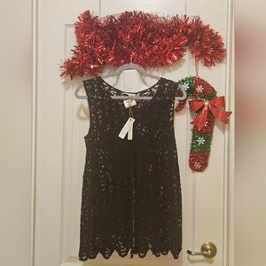 Capri Lace top see threw with embroidery. Pretty-split in back. Med NWT formal